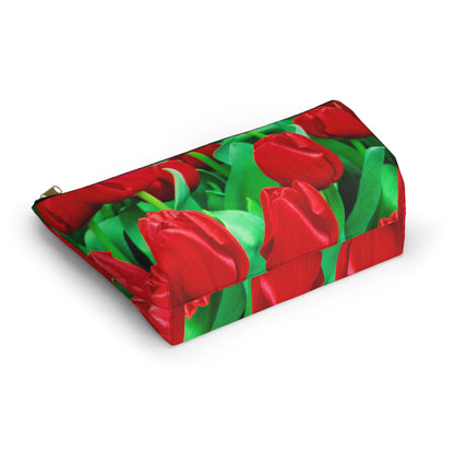 Bottom view of the kit bag with red tulips design angled to showcase the depth and all over print design.