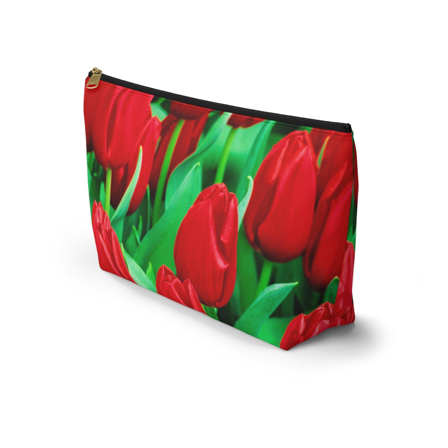 Front view of the kit bag with red tulips design angled to showcase the depth and all over print design.