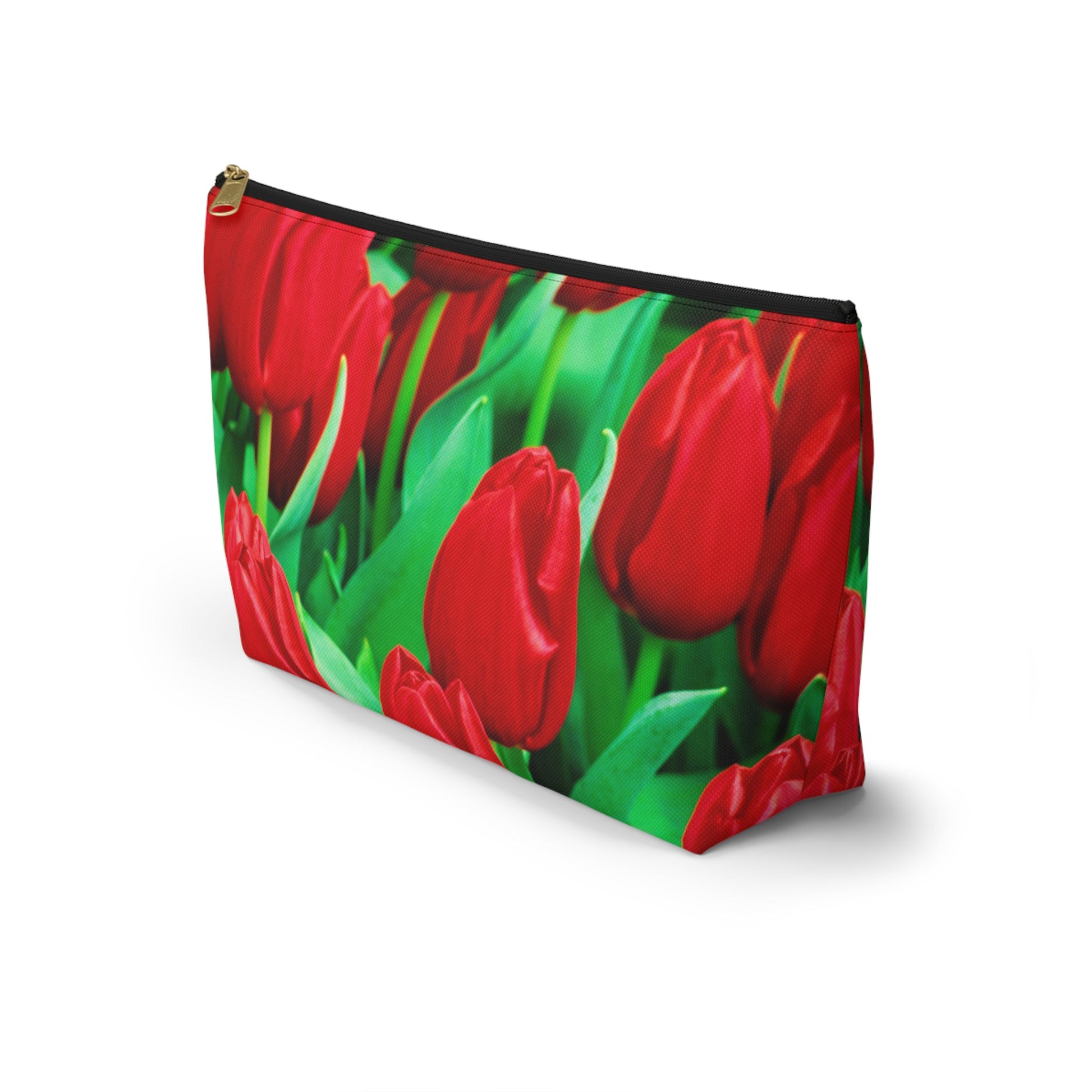 Front view of the kit bag with red tulips design angled to showcase the depth and all over print design.