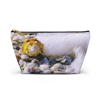 Front view of the small 8.75 x 4.75 x 2.25 inch kit bag with shell in surf design and black zipper.