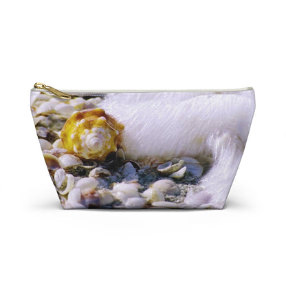 Front view of the small 8.75 x 4.75 x 2.25 inch kit bag with shell in surf design and white zipper.