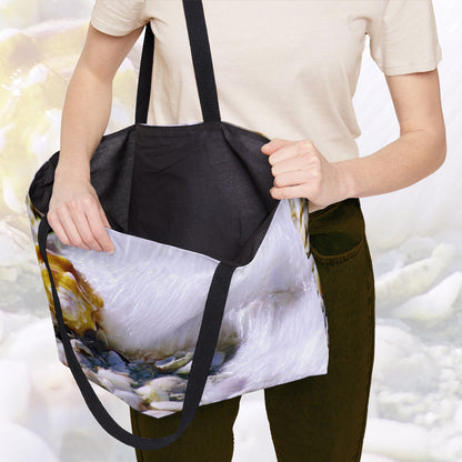 A woman holding open a weekender bag featuring the shell in surf design, showcasing the roomy interior.