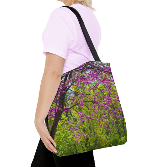 Young woman with a tote bag featuring the tree blossoms design draped across her shoulder.