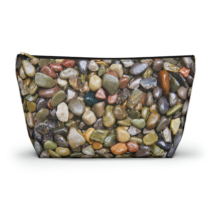 Zippered kit bag featuring vibrant photo art close up of wet glistening multi colored pebbles and stones.