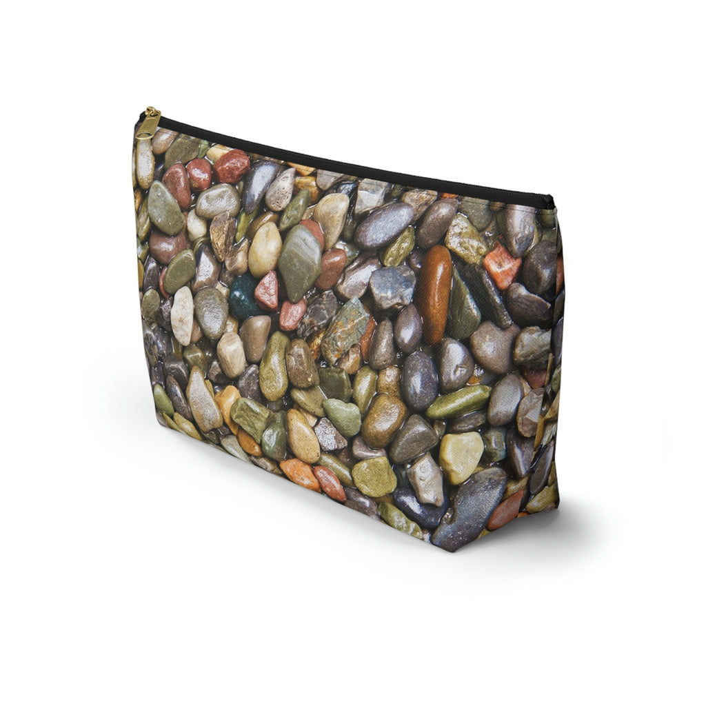 Front view of the kit bag with pebbles and stones design angled to showcase the depth and all over print design.