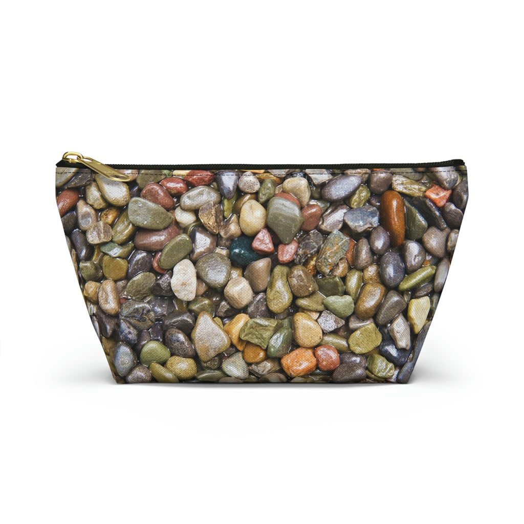 Front view of the small 8.75 x 4.75 x 2.25 inch kit bag with pebbles and stones design and black zipper.