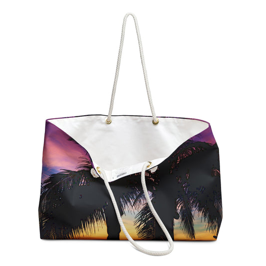 An open view of the beach bag with intense sunset design shows the cream colored interior lining.