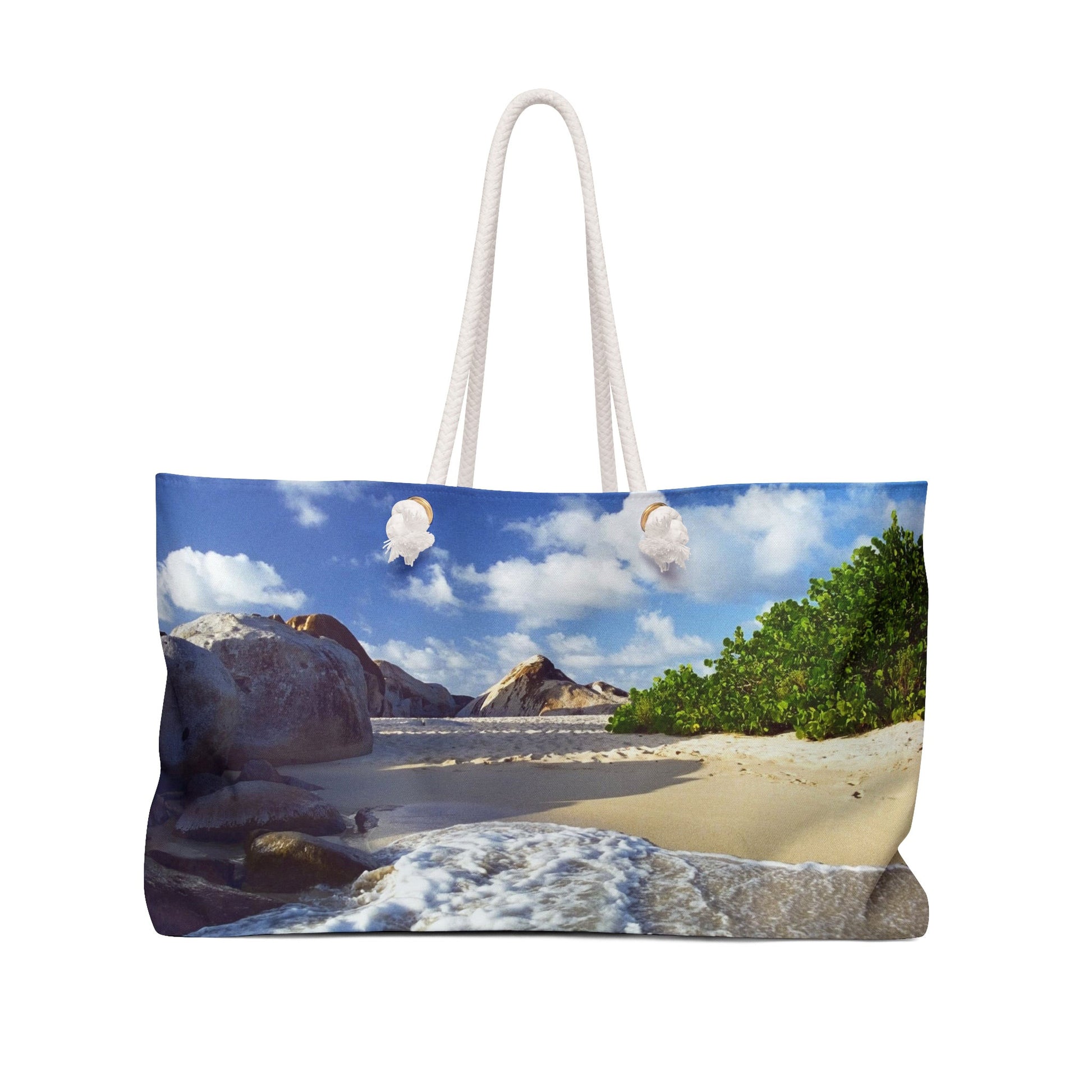 Front view of a beach bag featuring vibrant photo art of Caribbean beach landscape with surf and huge boulders.