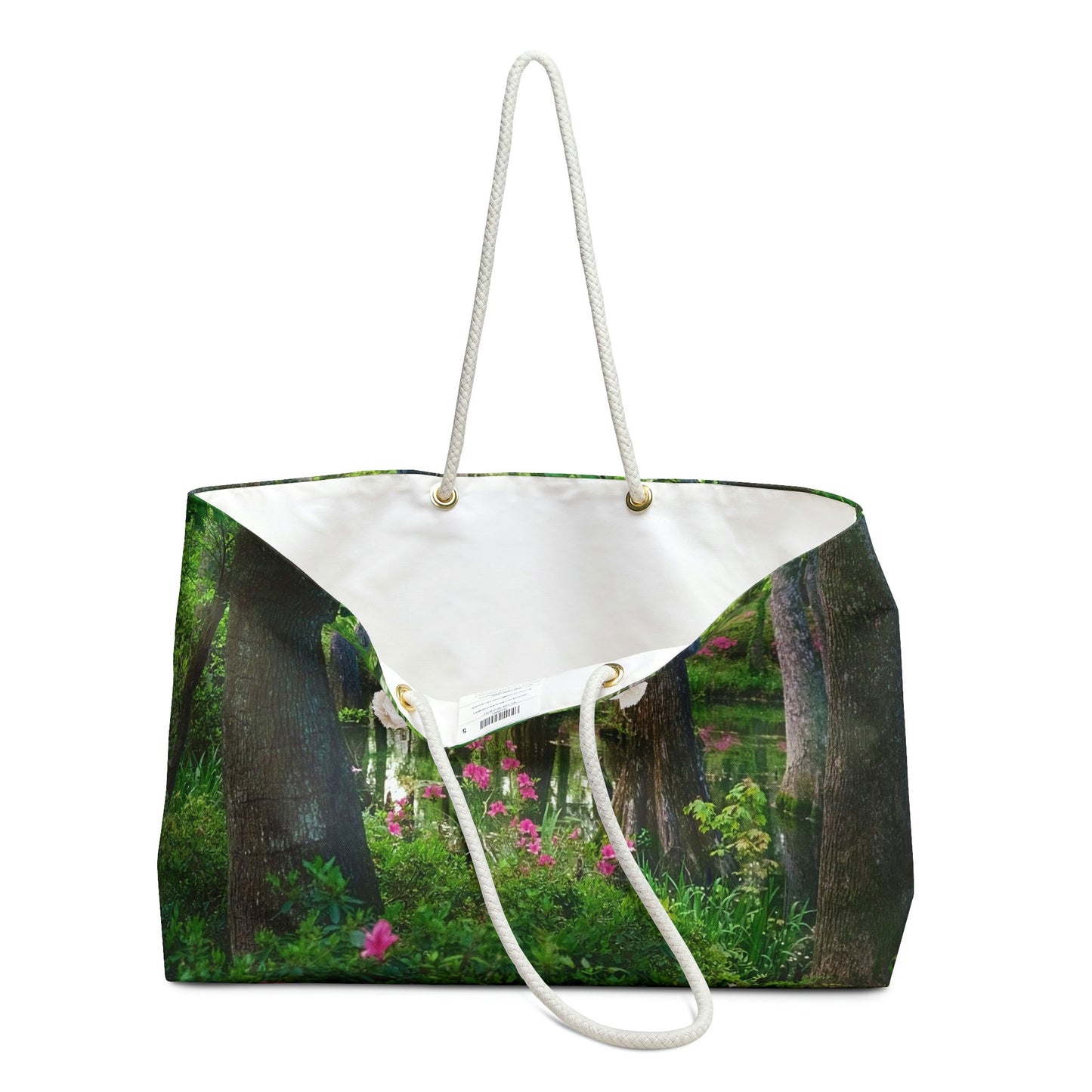 An open view of the beach bag with wetland design shows the cream colored interior lining.