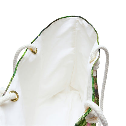 A close up view of the beach bag with wetland design shows the braided rope handles with metal grommets.