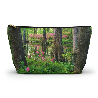 Zippered accessory pouch featuring vibrant photo art of lush green trees and hot pink colored flowers in a Southern wetland.