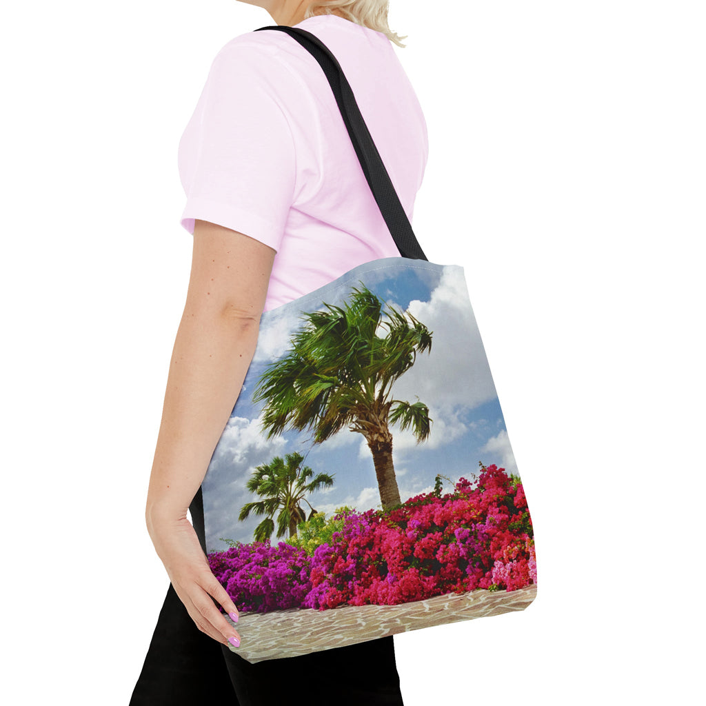 Young woman with a tote bag featuring the tropical flowers design draped across her shoulder.