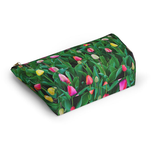 Bottom view of the kit bag with multi colored tulips design angled to showcase the depth and all over print design.