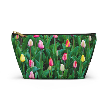Front view of the small 8.75 x 4.75 x 2.25 inch kit bag with multi colored tulips design and black zipper.