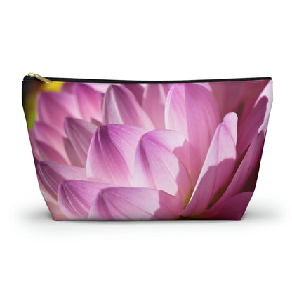Zippered accessory pouch featuring a vibrant photo art close up of pinkish violet colored flower petals in warm sunset light.