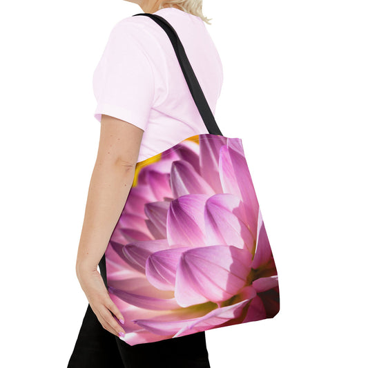 Young woman with a tote bag featuring the flower petals design draped across her shoulder.