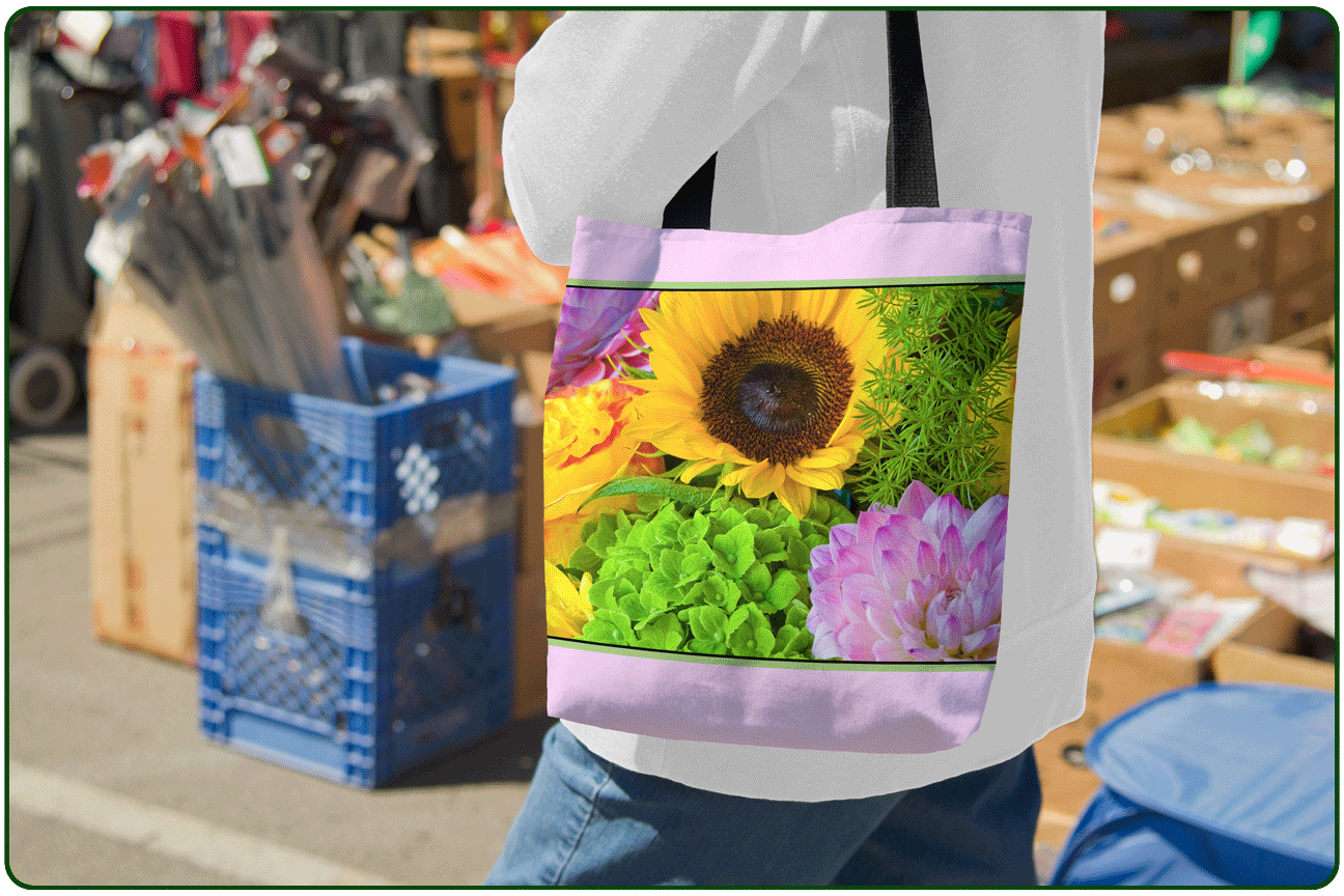 Woman with tote bag shopping at a farmers market.